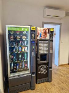 a vending machine with a dog on the side of it at Ubytovňa Železničná in Stupava