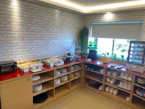 a kitchen with a counter with food on it at Kenting Southern Dream Resort in Kenting