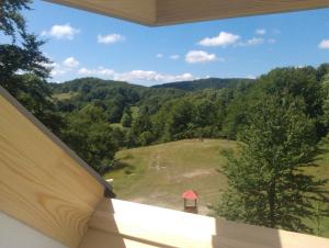 a view of a mountain from a house balcony at Eva Luxury Rooms & Apartments in Plitvička Jezera
