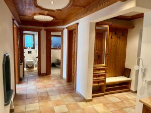 a hallway of a home with a bathroom with a toilet at Appartement Josefine in Bramberg am Wildkogel