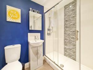 a bathroom with a shower and a toilet and a sink at Margaret's Ground by Fortuna Property in Cheltenham +27 photos