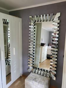 a room with a wall filled with wine bottles at TT Mansion in Oslo