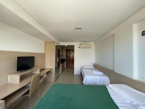 En eller flere senge i et værelse på Flat Mar C Branco - beira-mar + 14 billeder