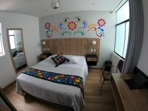 Postel nebo postele na pokoji v ubytování Platero Hotel