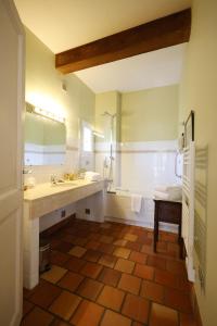 a bathroom with a sink and a shower and a tub at Hotel Le Mas Trilles in Céret +88 photos