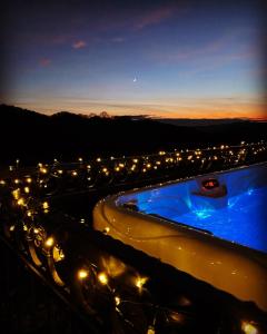 a hot tub with lights on the side of a road at Holiday Home Medimurski Ceker in Sveti Martin na Muri