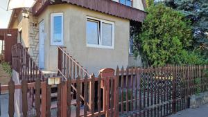 a wooden fence in front of a house at Friendly Apartment in the suburb. in Budapest