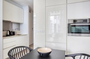 a kitchen with a table with a bowl on it at Spectacular 1BR Apartment in Singapore! in Singapore