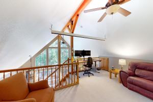 a living room with a ceiling fan and a couch at Fawn Voyage in Portola