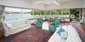 a living room with a view of the water at Vipers Quay in Dartmouth