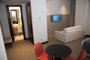 TV a/nebo společenská místnost v ubytování Hotel Continental Horizonte