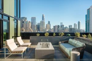 a rooftop patio with a view of the city at SoMa 1br w rooftop bbq concierge nr Bart SFO-1431 in San Francisco