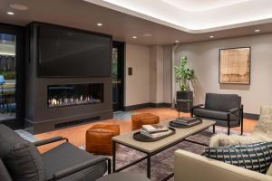 a living room with a fireplace and a tv at SoMa 1br w rooftop bbq concierge nr Bart SFO-1431 in San Francisco