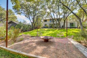 a yard with chairs and a fire pit and a house at Modern Austin Home with Yard about 1 Mi from ACL! in Austin