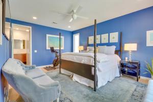 a blue bedroom with a bed and two chairs at Modern Austin Home with Yard about 1 Mi from ACL! in Austin