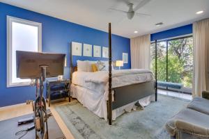 a bedroom with a bed and a bike in a room at Modern Austin Home with Yard about 1 Mi from ACL! in Austin +35 photos
