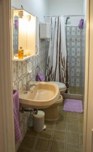 a bathroom with a sink and a toilet at B&B dei Filosofi Bed and Breakfast in Perugia +16 photos