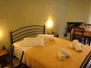 Posteľ alebo postele v izbe v ubytovaní Guesthouse Eleftherios