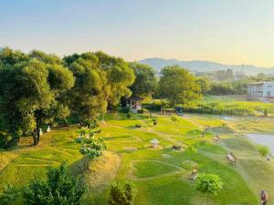 an aerial view of a park with people playing golf at Apartmani COLOSSEUM in Bratunac