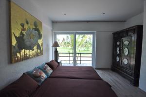 A bed or beds in a room at White Dragon Sea View Villa