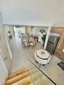 a dining room and living room with a table and chairs at Estrella Dominicus Advantage in Bayahibe