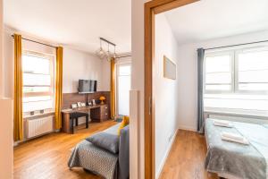 Posteľ alebo postele v izbe v ubytovaní Apartament Chmielna Loft