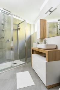 a bathroom with a shower and a sink at Villa San Carlo in Arona +82 photos