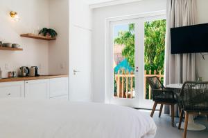 Un pat sau paturi într-o cameră la Pietermaai Oasis