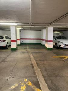 a parking garage with cars parked in it at Exyca Radazul in Radazul