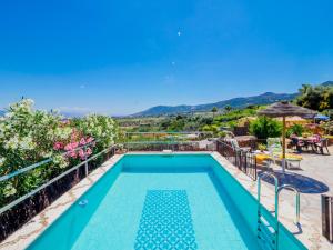 a villa with a swimming pool with a view at Cubo's Casa Rural El Cortijillo de las Barrancas in Alhaurín de la Torre