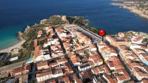 an aerial view of a town with a red balloon at NordEst SeaView in Santa Teresa Gallura