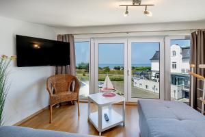 TV a/nebo společenská místnost v ubytování Appartement 4 - Ostseeblick