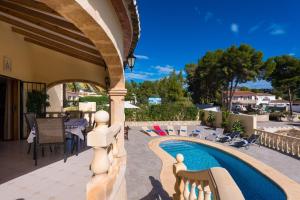 a patio with a swimming pool in a house at Villa Llobell - Plusholidays in Moraira