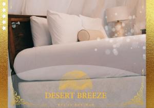 A bed or beds in a room at Desert Breeze Cocoon