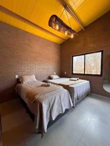 Postel nebo postele na pokoji v ubytování Casa ecológica Toca do Barreiro