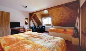 Postel nebo postele na pokoji v ubytování Wellness Hotel Holzberg