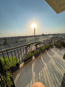 a balcony with a view of a field and a light at القاهره حلوان تقسيم سلاح المهندسين شارع الجبل in Sheikh Zayed