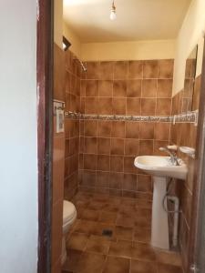 a bathroom with a sink and a toilet at la casa del baron in Tupiza