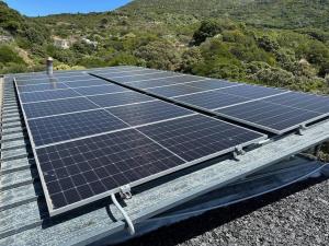 an array of solar panels on the roof of a house at Villa Rhulani - Luxurious modern Villa in Hout Bay in Hout Bay