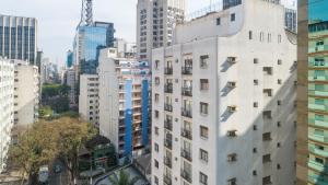 a view of a city skyline with tall buildings at Capcana Hotel Jardins in São Paulo