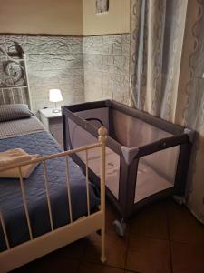 a bedroom with a bed with a blue bedspread at Il Gelsomineto dell'Etna in Nicolosi +19 photos