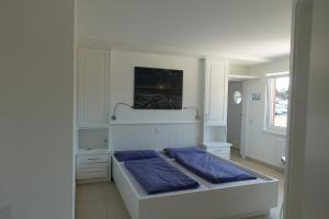 Postel nebo postele na pokoji v ubytování Haus Sanruus – Für Zwei