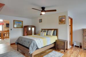 a bedroom with a bed and a ceiling fan at Spacious McMinnville Vacation Home with Gas Grill! in McMinnville