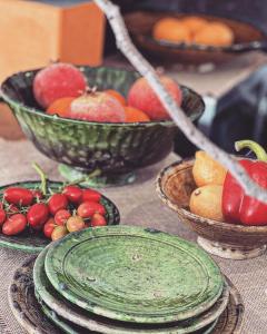 a table topped with bowls of fruits and vegetables at Luxueus appartement aan de Costa Blanca in Benissa