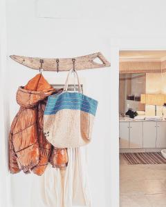 a bag hanging on a wall in a room at Luxueus appartement aan de Costa Blanca in Benissa