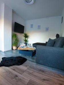 a living room with a couch and a table at Ferienhaus Pottschach 