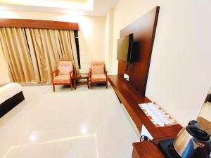 Televisor o centre d'entreteniment de Neelkanth Hotel