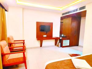 Televisor o centre d'entreteniment de Neelkanth Hotel