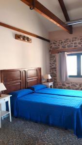 Postel nebo postele na pokoji v ubytování Ecoturismo Cabo Tiñoso
