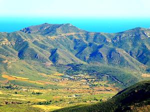 an aerial view of a mountain range with a town at Ecoturismo Cabo Tiñoso in Murcia